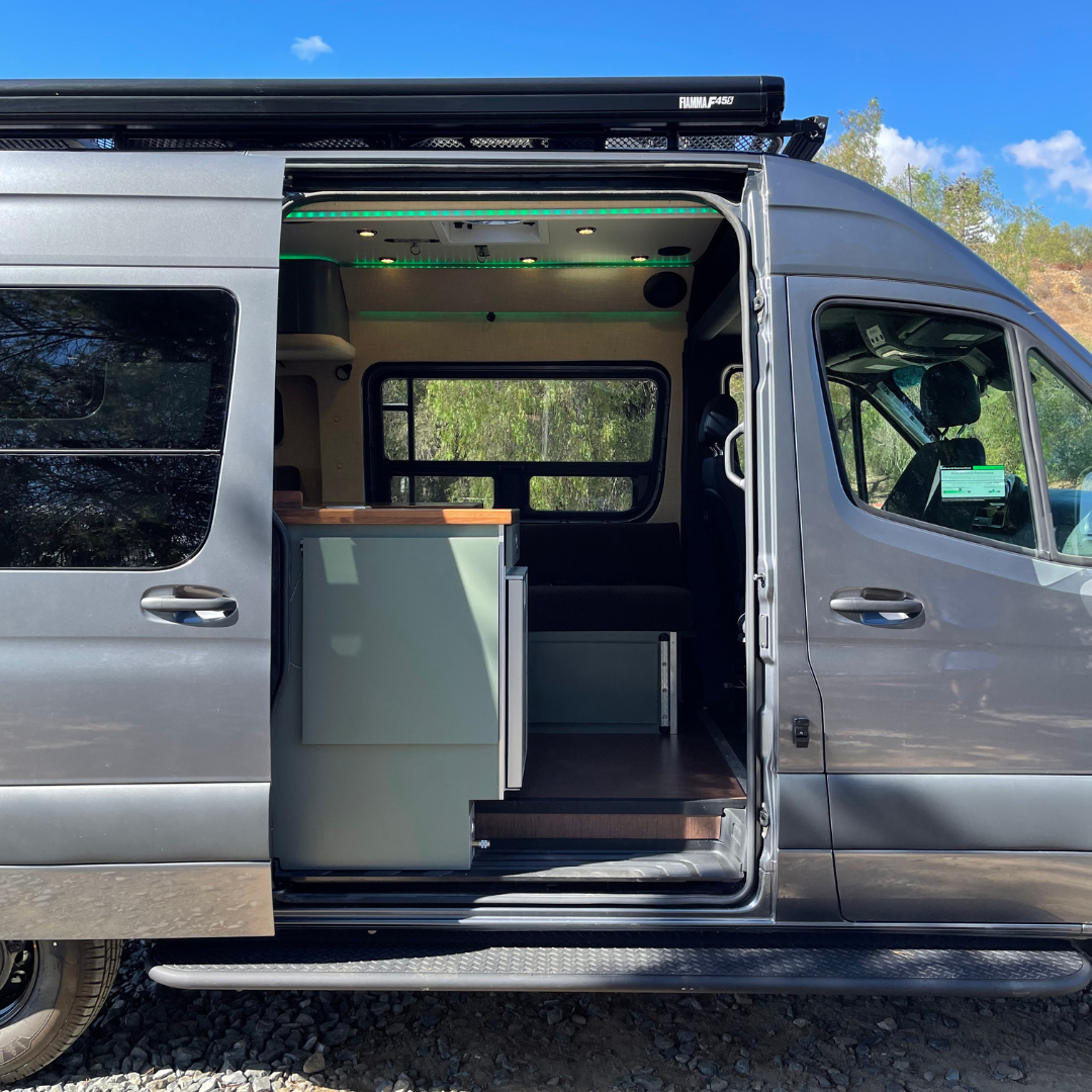 a campervan with its sliding door open