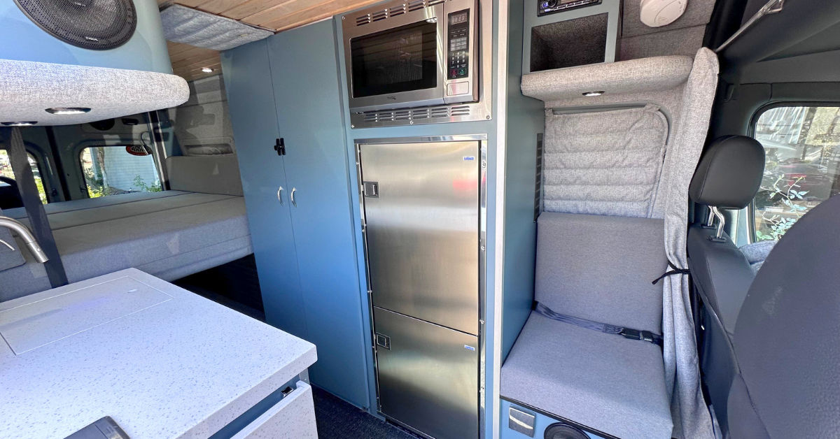 the intewrior of a blue campervan conversion