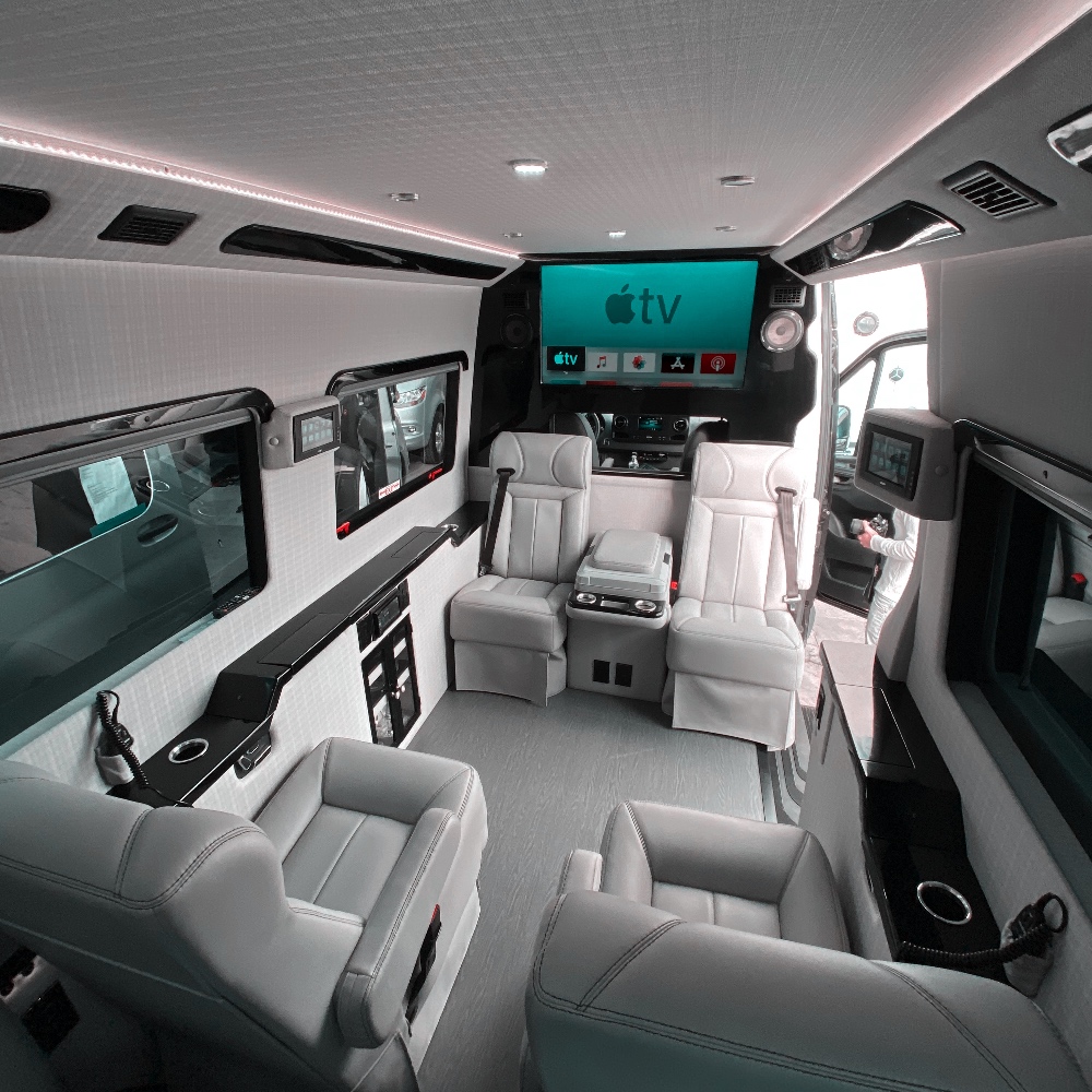 the interior of a mobile office in a sprinter van