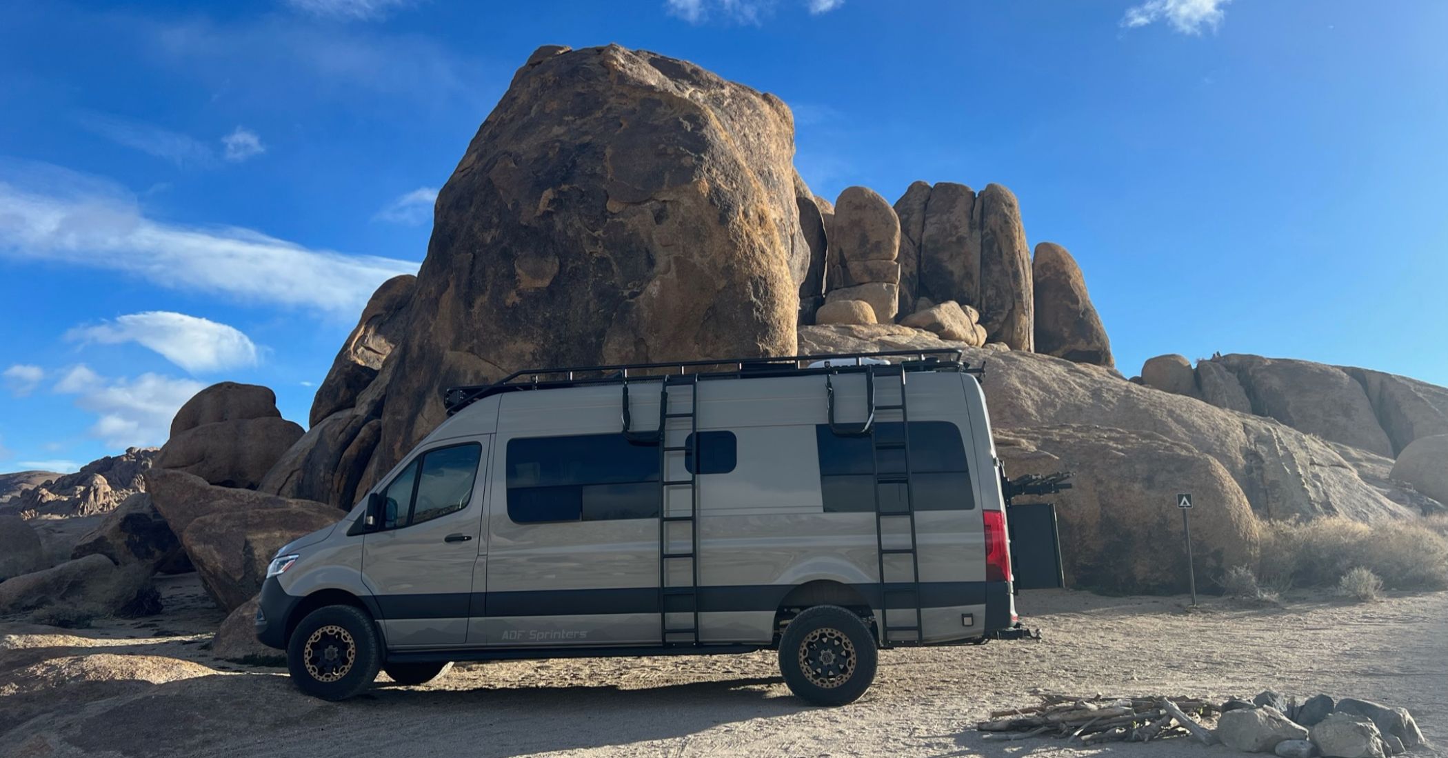 A campervan in a campsite in Joshua tree