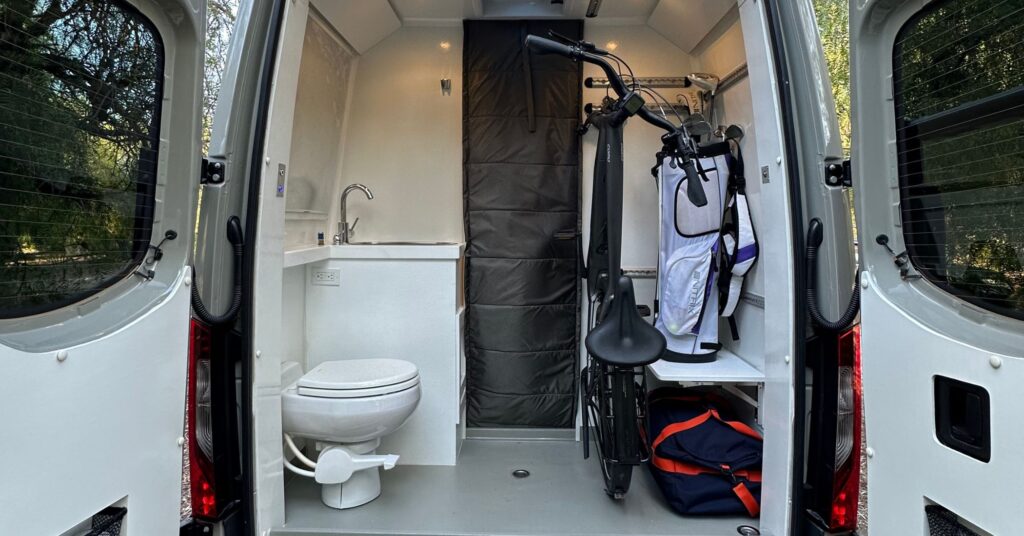 a campervan with the back section built out to be a bathroom